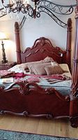 Front view showing carved headboard and footboard