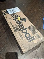 Boxed Spikeball set with printed instructions and logo visible on the packaging.