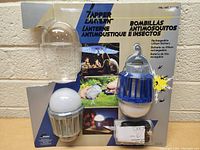 Photo of the two bug zapper lights still in original packaging showing the product and battery information.