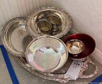 Photo showing the full set including platter, three bowls, pair of Paul Revere bowls, sugar and creamer set. Items have tarnish and signs of wear and need cleaning.