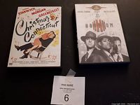 Photo of two DVD cases: Christmas in Connecticut and Hoodlum, showing their front cover artwork and condition.