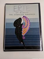 Front cover of the book showing the title and artwork by Erté