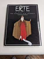 Front cover of the book showing the title 'ERTÉ AT NINETY-FIVE THE COMPLETE NEW GRAPHICS THE EXTENDED EDITION' with an illustration of a figure in a brown and red costume.