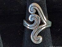Front view showing scroll design and overall shape of James Avery sterling silver ring.