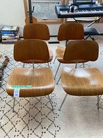 Front view of all four chairs showing overall design and condition
