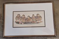 Framed print showing six ducks with floral elements.