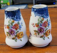 Pair of two small Royal Winton Grimwades vases with floral and blue border decoration.