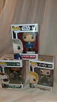 Lot photo showing all three boxed Pop! figures: Han Solo (Snow Gear) from Star Wars, Agent Smith from The Matrix, and Hoban Washburne from Firefly.