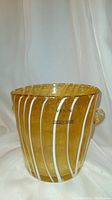 Front view showing yellow glass with white streaks and Venini Murano Italy label.