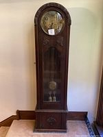 Full front view of the oak grandmother clock showing overall form and condition