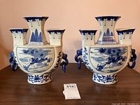 Front view of both vases showing dragon design and matching profiles