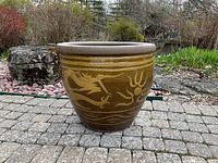 Front view showing dragon motif on curved surface