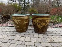 Front view of both planters side by side on stone patio