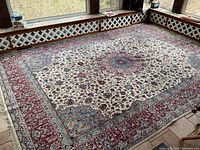 Full view of the carpet in situ showing overall size, pattern and condition