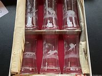 Boxed set of 6 tall etched glasses each with different wildlife etching