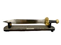 Full view of sword on stand, side orientation