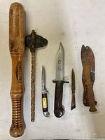 Top-down view of all six cutting tools including baseball bat, stone axe, and various knives