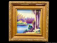 Frontal view of the framed hand painted porcelain tile showing colorful landscape.