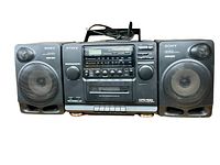 Full frontal view of the Sony CFD-510 boombox showing detachable speakers and control panel with buttons, knobs, and digital display
