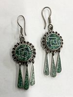 Front view of the pair of earrings showing the green mosaic turquoise stones and silver setting with dangles
