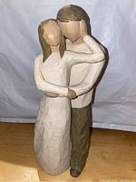 Front view of the Willow Tree 'Together' figurine showing the embracing couple with carved texture and natural muted colors.