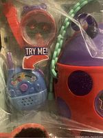 Photo of toy stethoscope, medical case, and additional items inside sealed plastic packaging