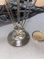 Close-up photo of the metal base and bottom part of the frame holder showing details and condition