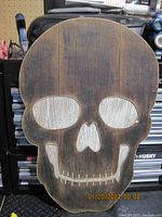 Front view of hand made wooden skull wall art showing full skull shape and design.