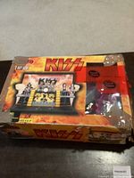 Damaged box of KISS Play Set No. 003 featuring band image and logos