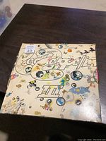 Front cover of the Led Zeppelin III double album showing the colorful, illustrated psychedelic artwork with the band name and album number.