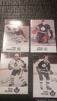 Four vintage Toronto Maple Leafs hockey cards showing Frank Mahovlich, Johnny Bower, Borje Salming, and Darryl Sittler.