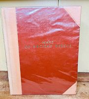 Front cover showing red half-leather binding with gold title “Maps of Ancient Greece” under clear plastic sleeve