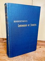 Front cover of the book showing blue cloth with gold embossed title 'Robertson's Landmarks of Toronto'.