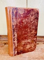 Front cover of 'Awful Disclosures' showing worn reddish-brown leather with reinforced spine.