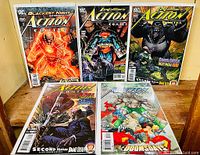 Front view of five Action Comics issues displayed, each featuring Lex Luthor prominently on the cover with varying scenes such as glowing energy, a gorilla, swords, and Doomsday characters