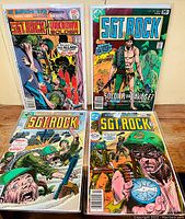 Four Sgt. Rock comics laid flat, showing cover artwork including Sgt. Rock Presents Unknown Soldier, issue with a soldier in jungle setting, and other wartime scenes.