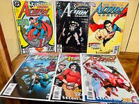 Front view of six DC Comics Action Comics issues showing colorful covers featuring Superman.