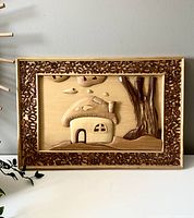 Front view of the wooden carved mushroom house picture with walnut slice border.