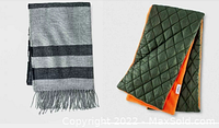 Two men's scarves laid side by side: a gray and blue striped knit scarf with fringe, and a quilted reversible scarf with green outer side and orange fleece inner side.