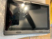 Front view of the 7-inch Android tablet showing front speakers and front camera.
