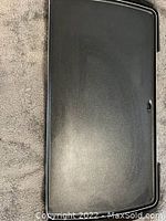 Top-down view of the electric skillet showing the black non-stick cooking surface and overall rectangular shape.