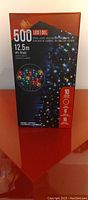 Front of box for 500 count LED string lights, showing multicolor bulbs, 12.5 meter length, waterproof rated, 10 modes.