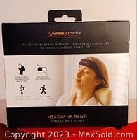 Front of original box showing product name, man wearing band, and key features such as drug-free relief for headaches, migraines, and sinus pain.