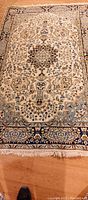 Full view of Persian wool rug showing overall design and color.
