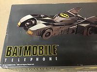 Close-up photo of Batmobile image and branding on box.