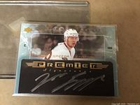 Front of Jason Spezza signed hockey trading card showing image, autograph, and design details.