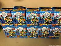 10 Marvel Heroclix Colossal figures in original boxes with X-Men artwork display front and side views of boxes