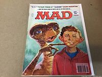 Front cover of MAD magazine showing E.T. and Alfred E. Neuman, highlighting the issue's collectible nature and good condition.