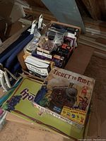 Top view of two stacked boxes showing Ticket to Ride on top and other boxed games beneath