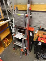 Folded ladder closed, showing overall size, platform and wheel assembly